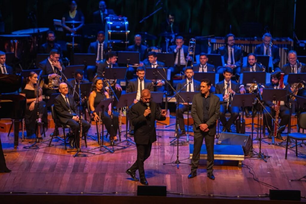 FeMusiK II começou neste domingo e reúne músicos de diferentes países em semana de concertos e atividades em Novo Hamburgo A abertura do FeMusiK contou com concerto da Orquestra de Sopros de Novo Hamburgo no Teatro Feevale. Foto: Thiago Dorscheid/PMNH